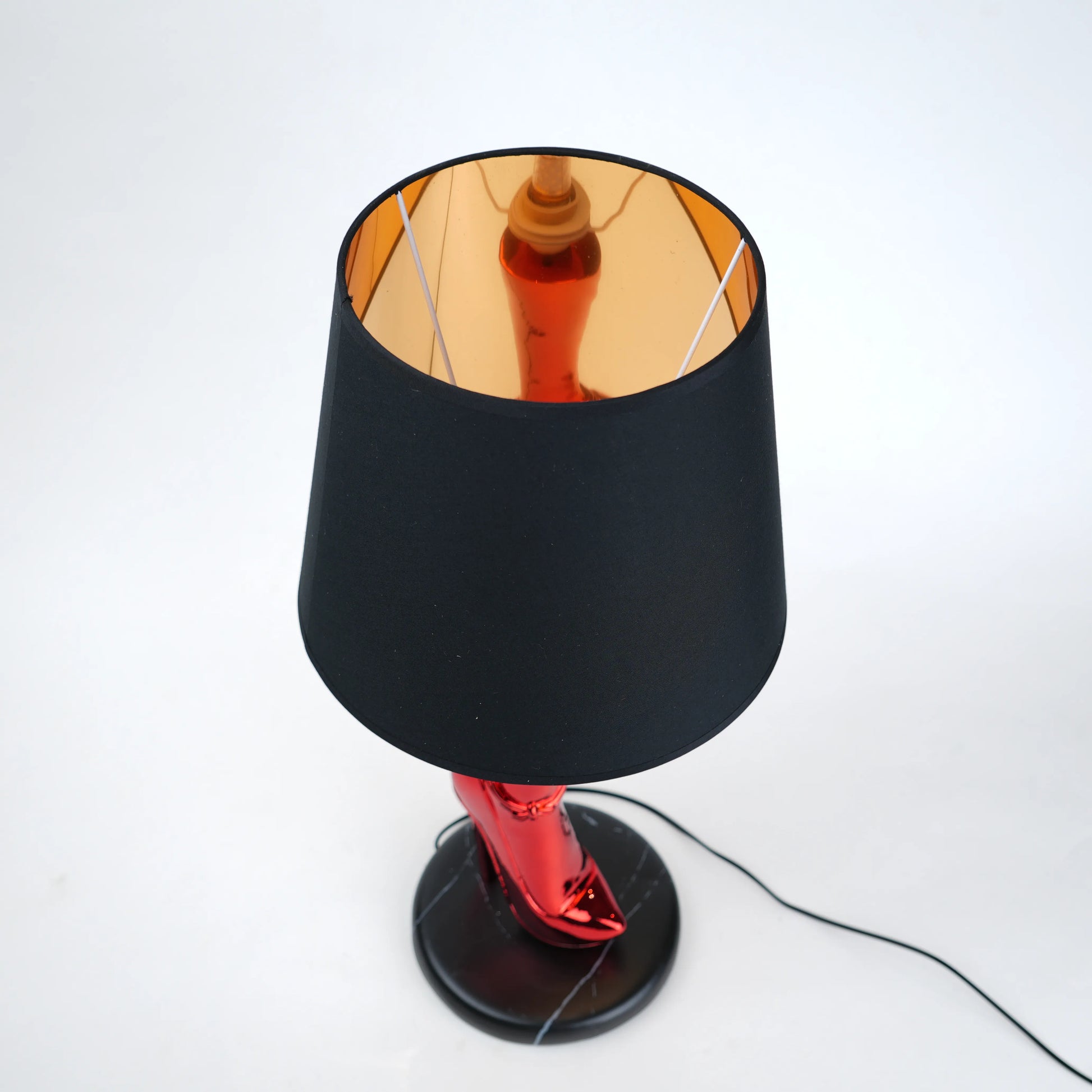 Table lamp with black base and shade on a white background