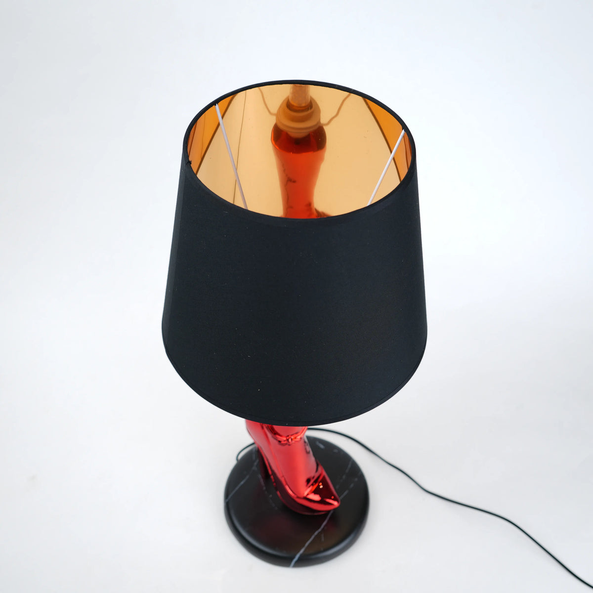Table lamp with black base and shade on a white background