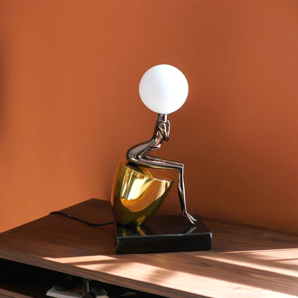 Noir Figure Table Lamp black sculptural base with globe light