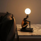 Noir Figure Table Lamp ambient lighting on tabletop