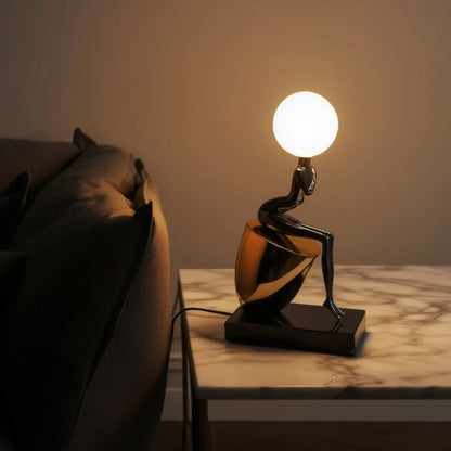 Noir Figure Table Lamp ambient lighting on tabletop