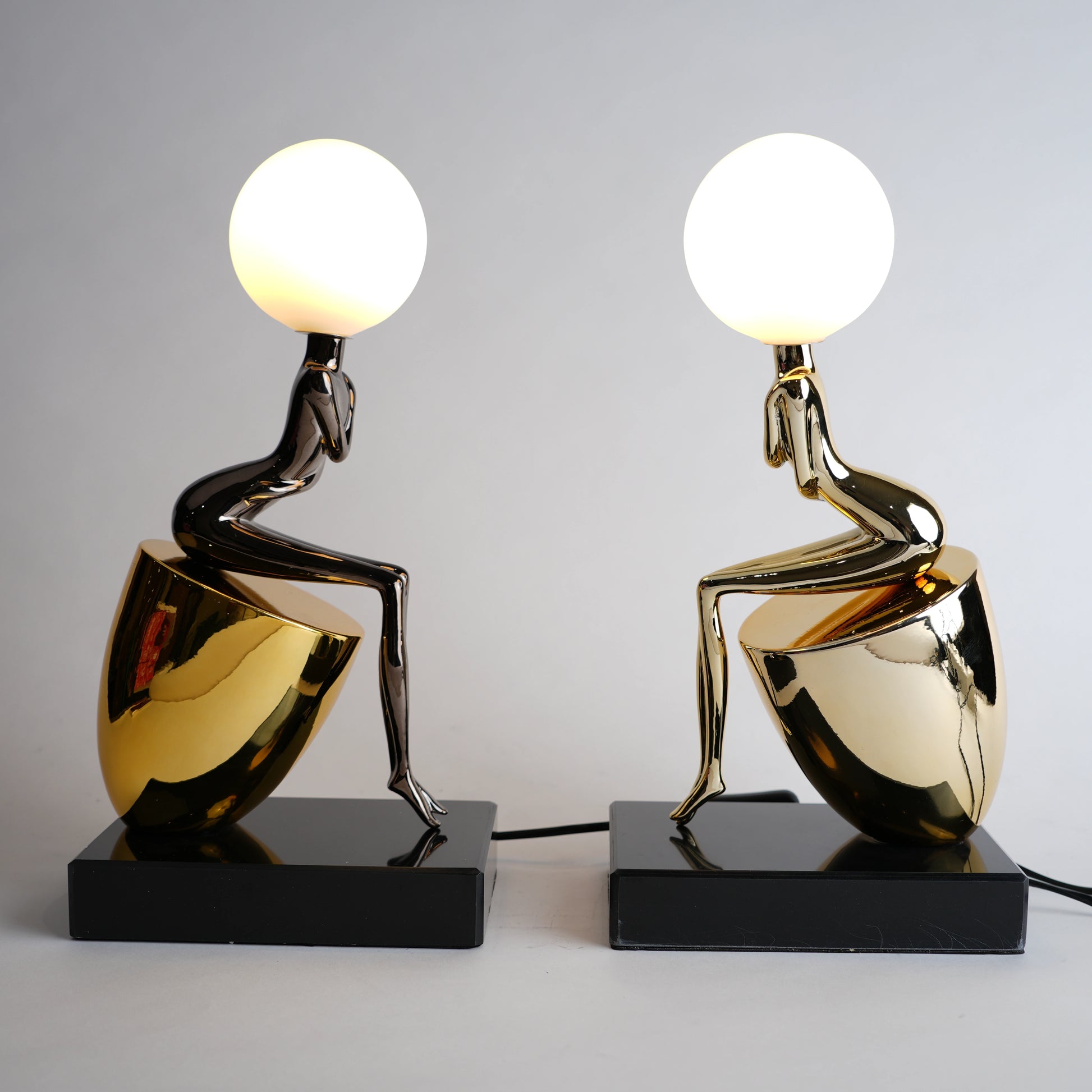 modern gold lamp with spherical light decor
