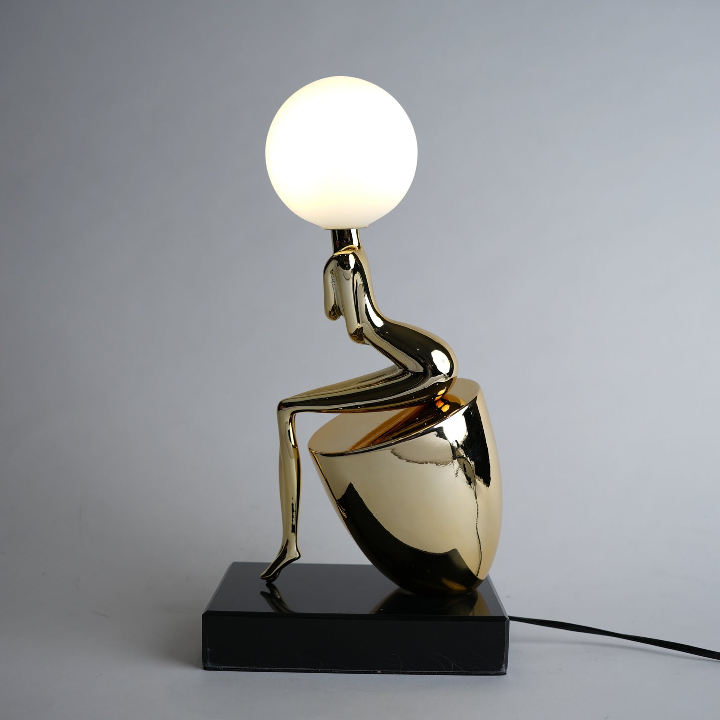 modern gold lamp with spherical light decor