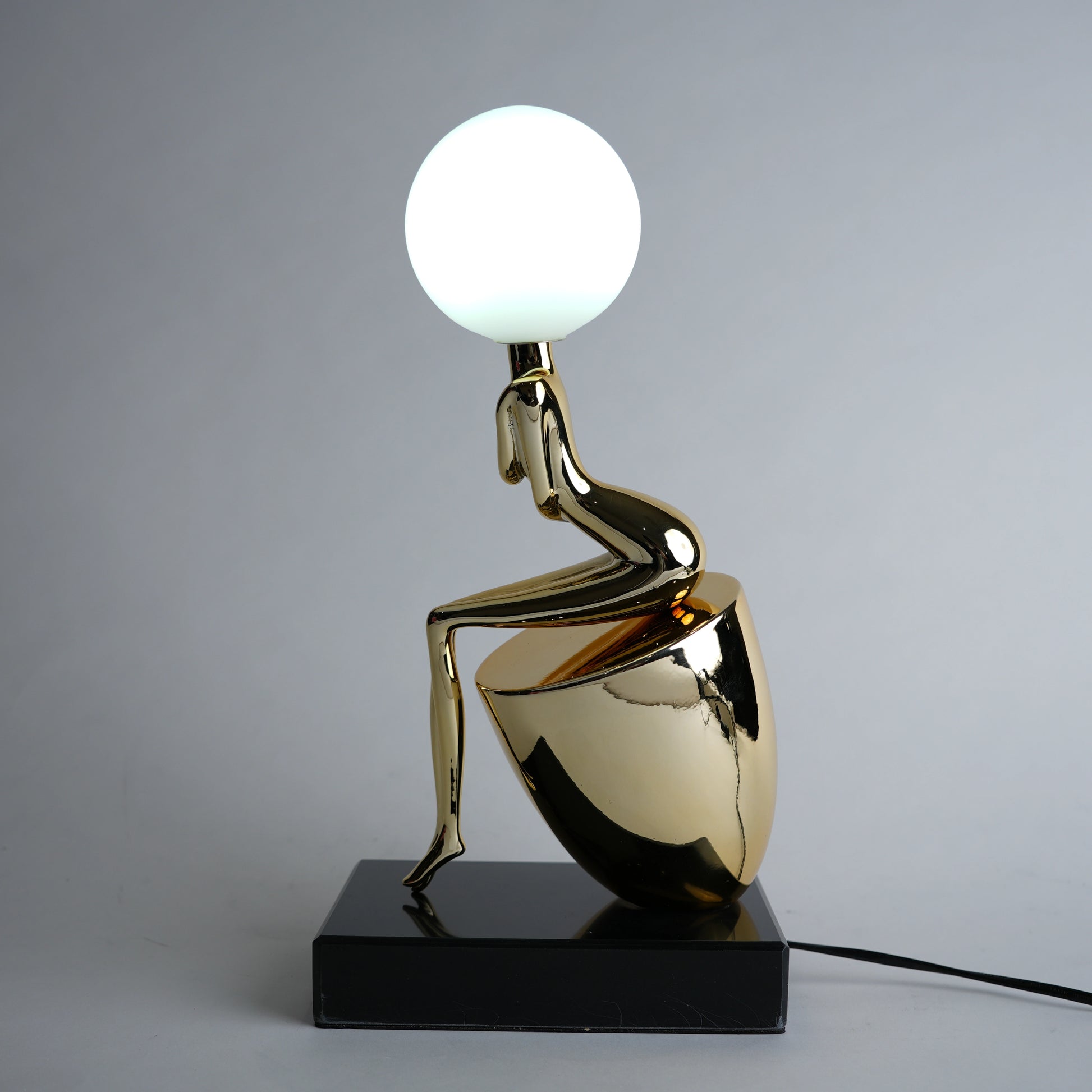 modern gold lamp with spherical light decor
