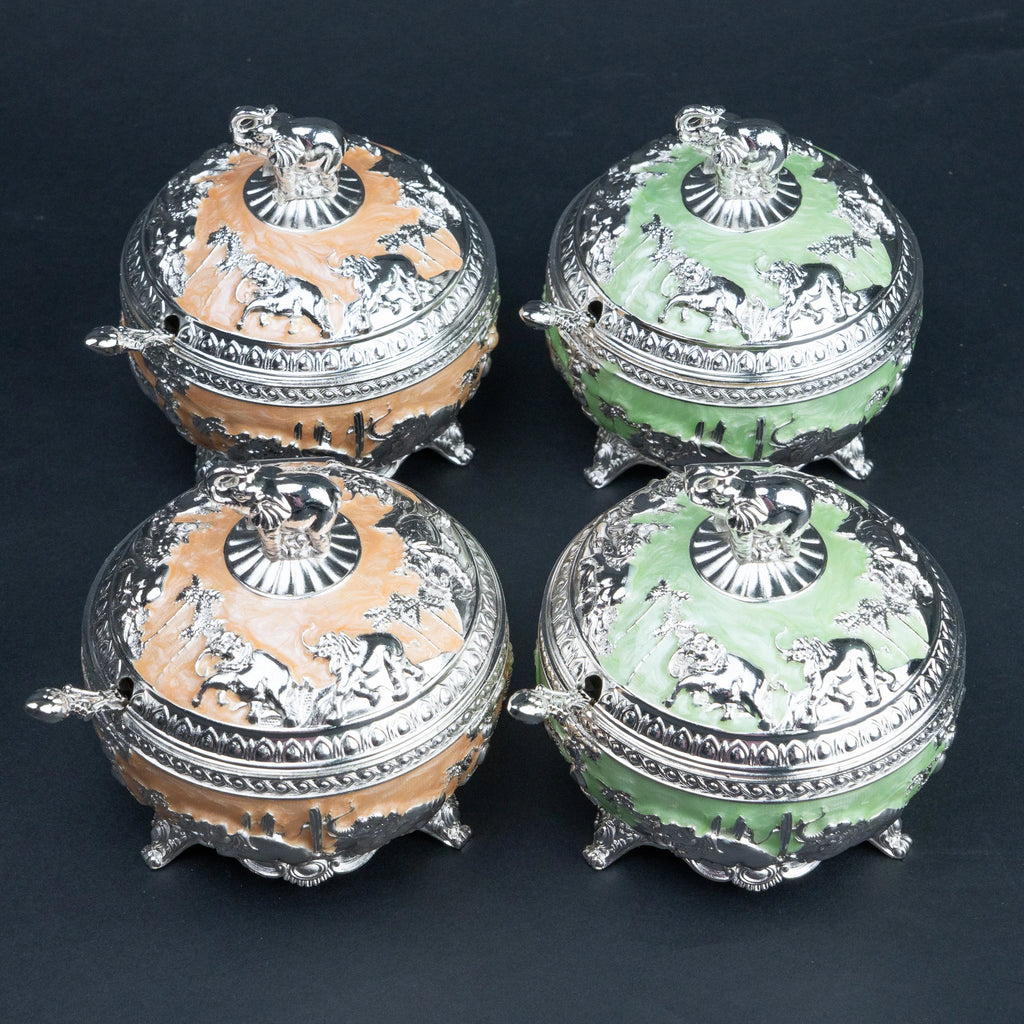 Mint green and peach elephant decorative containers with silver detailing and matching spoons