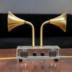 Brass tone dual horn speaker decor with clear rectangular base
