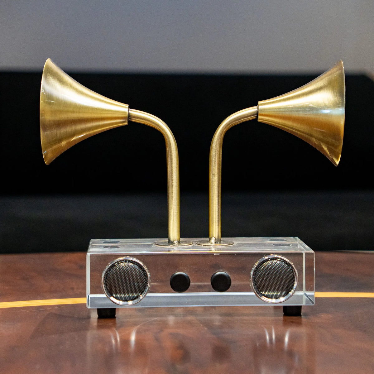Brass tone dual horn speaker decor with clear rectangular base