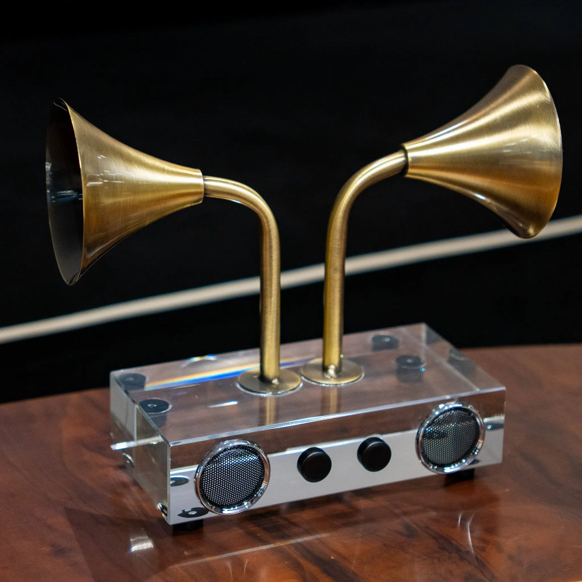 Brass Echo speaker decor with twin flared horns and clear base