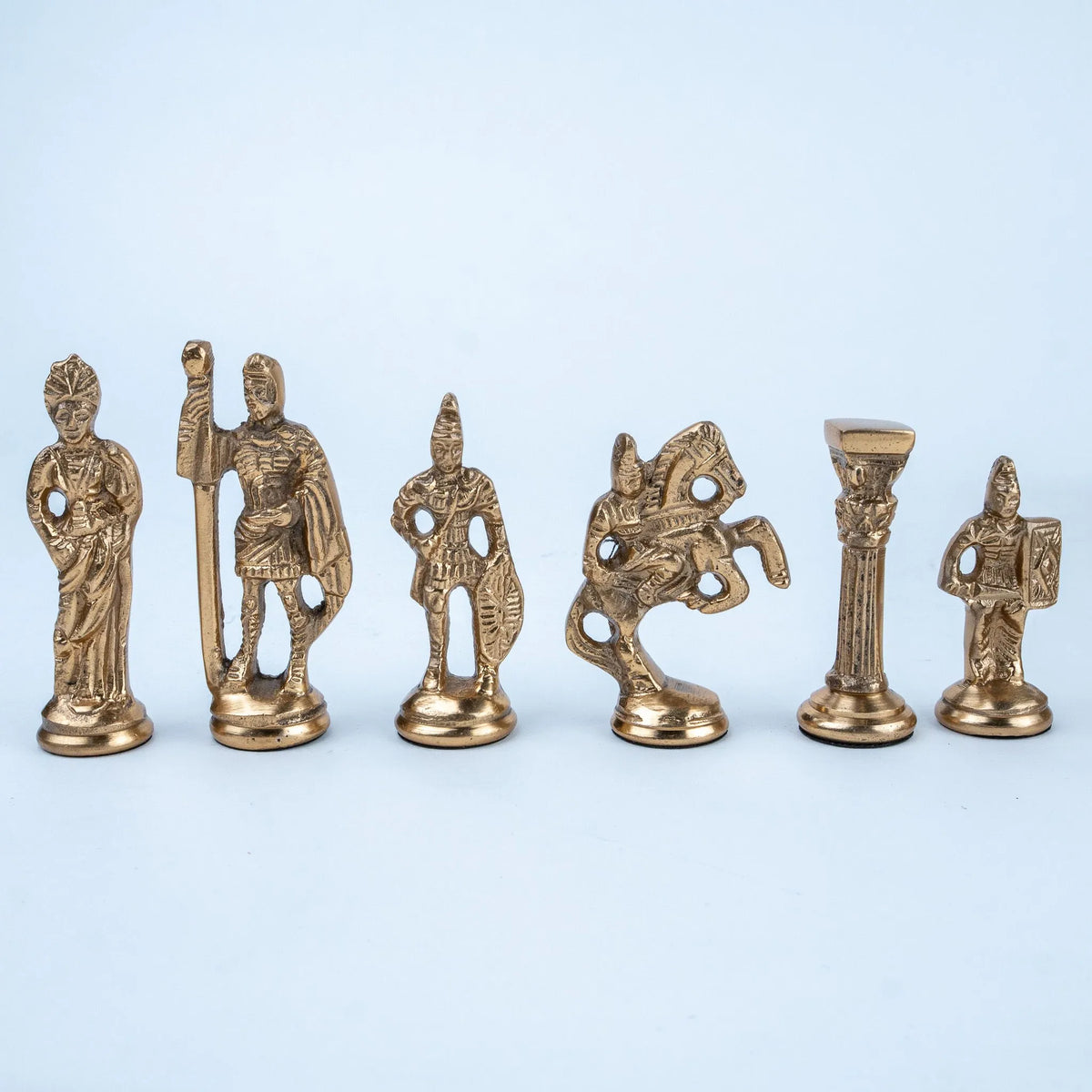Royal-style chess set displayed on a marble coffee table in a luxury living room.