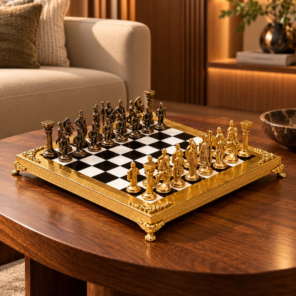 An ornate chess set with a gold-plated frame and metallic gold and bronze figurines, arranged on a black and white checkered board over a white marble surface.