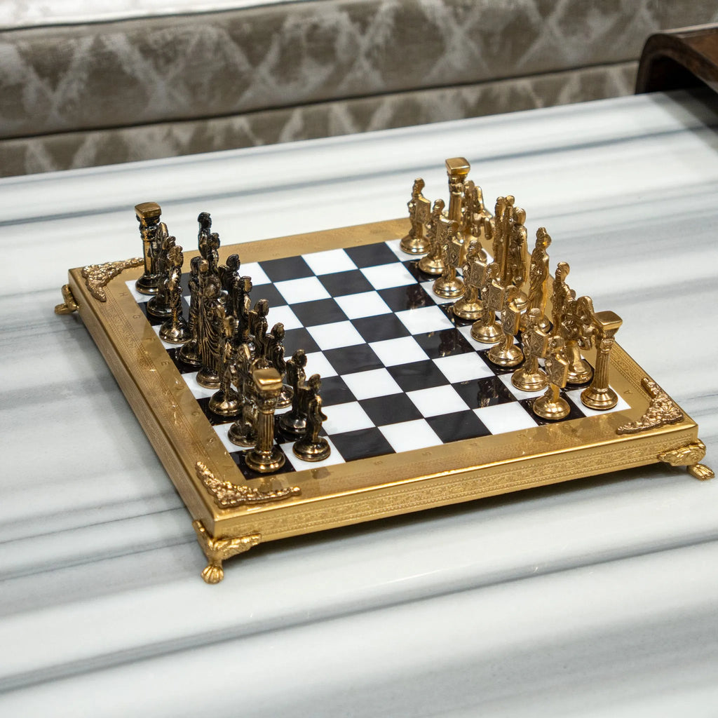 Royal-style chess set displayed on a marble coffee table in a luxury living room.