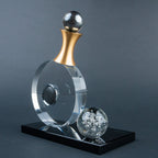 Guitar-inspired home décor accent with transparent circular body and gold-tone details.
