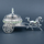Luxury silver horse-drawn carriage showpiece featuring an intricately crafted ornamental carriage with an elegant domed lidded design, detailed filigree patterns, decorative crystal-like embellishments, finely sculpted horse figurine and beautifully designed spoked wheels. The polished silver finish and elaborate craftsmanship make it an elegant statement piece for luxury home décor, display cabinets and sophisticated interiors.