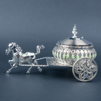 Luxury silver horse-drawn carriage showpiece featuring an intricately crafted ornamental carriage with an elegant domed lidded design, detailed filigree patterns, decorative crystal-like embellishments, finely sculpted horse figurine and beautifully designed spoked wheels. The polished silver finish and elaborate craftsmanship make it an elegant statement piece for luxury home décor, display cabinets and sophisticated interiors.