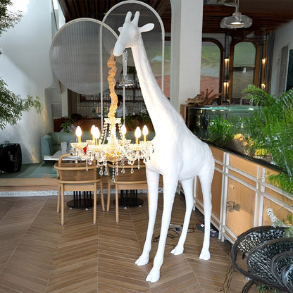 Large white giraffe chandelier sculpture with crystal lighting and gold accents