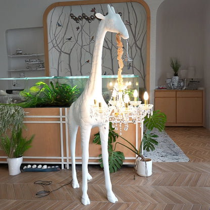 Large white giraffe chandelier sculpture with crystal lighting and gold accents