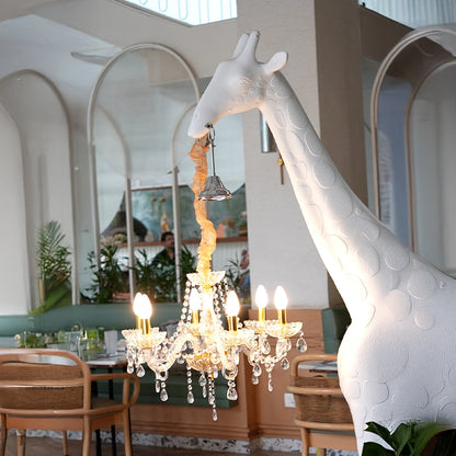 Large white giraffe chandelier sculpture with crystal lighting and gold accents