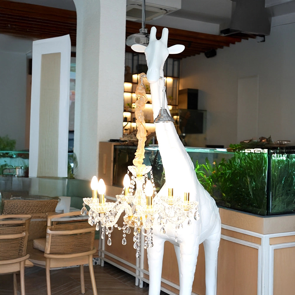 Large white giraffe chandelier sculpture with crystal lighting and gold accents