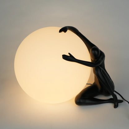 Black human sculpture lamp embracing glowing orb – Midnight Embrace Lamp