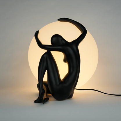 Black human sculpture lamp embracing glowing orb – Midnight Embrace Lamp