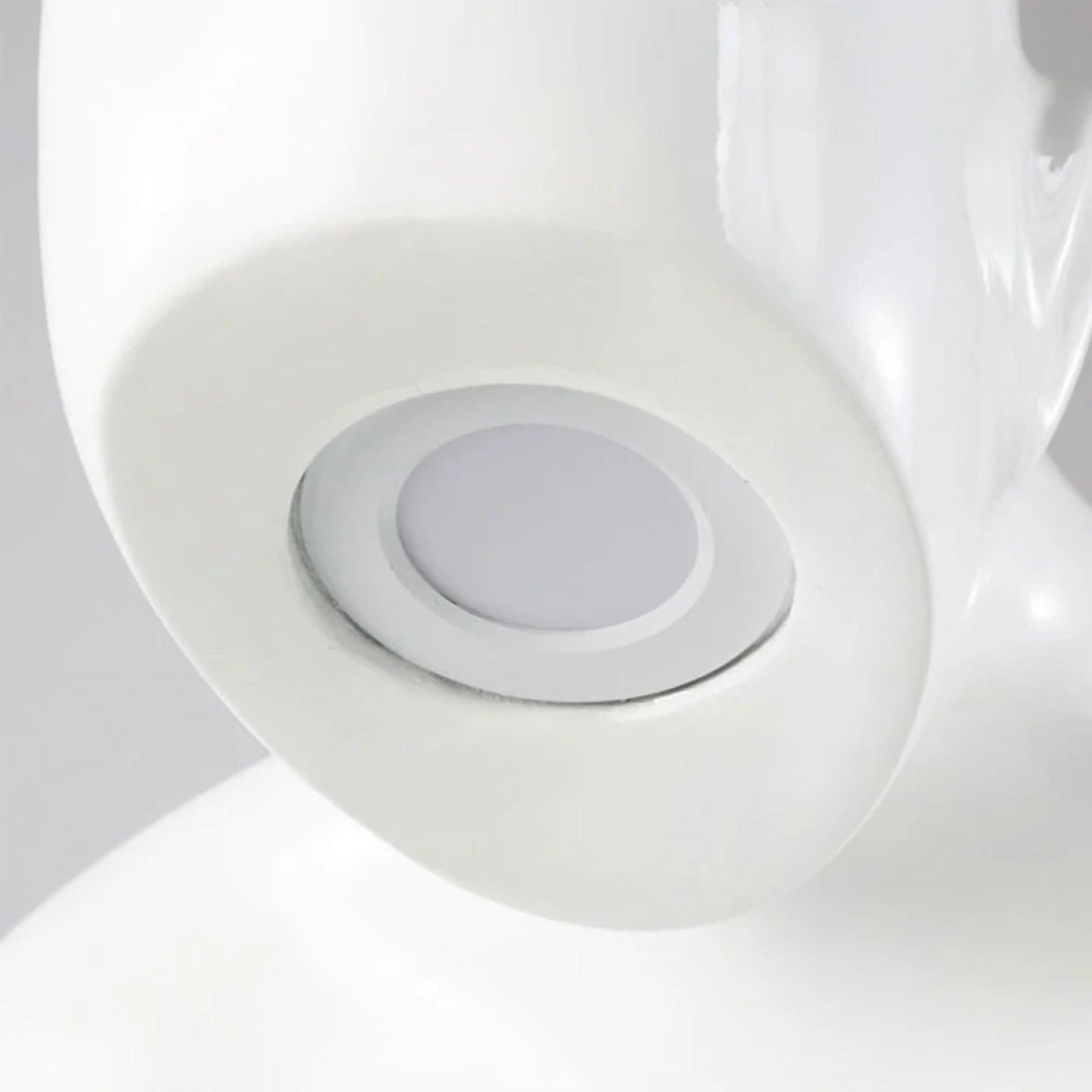 Glossy white reading sculpture lamp with abstract seated figure holding a book and built-in LED light.