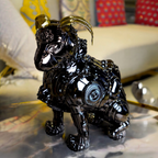 chrome black mechanical dog sculpture with gold accent ears
