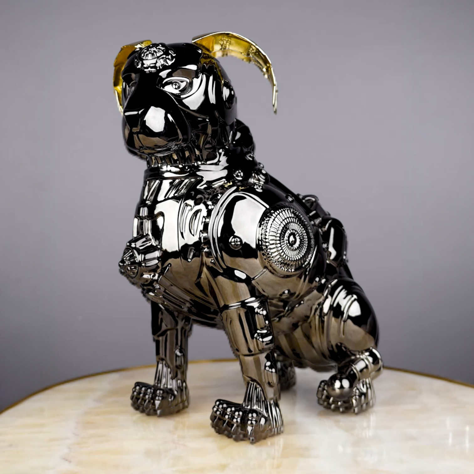 chrome black mechanical dog sculpture with gold accent ears