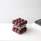 Oxblood ball cube, silver core, 3/4 view