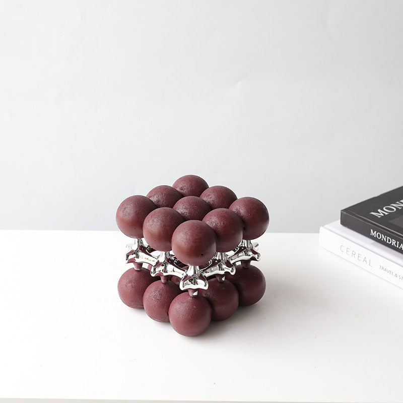 Oxblood ball cube, silver core, 3/4 view
