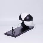 Triumph rear 3/4, segmented sphere on plinth