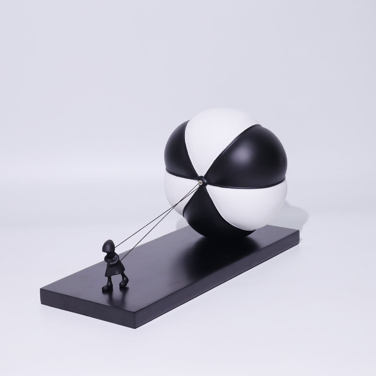 Triumph rear 3/4, segmented sphere on plinth