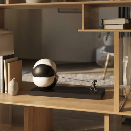 Triumph figure pulling split sphere, oak shelf