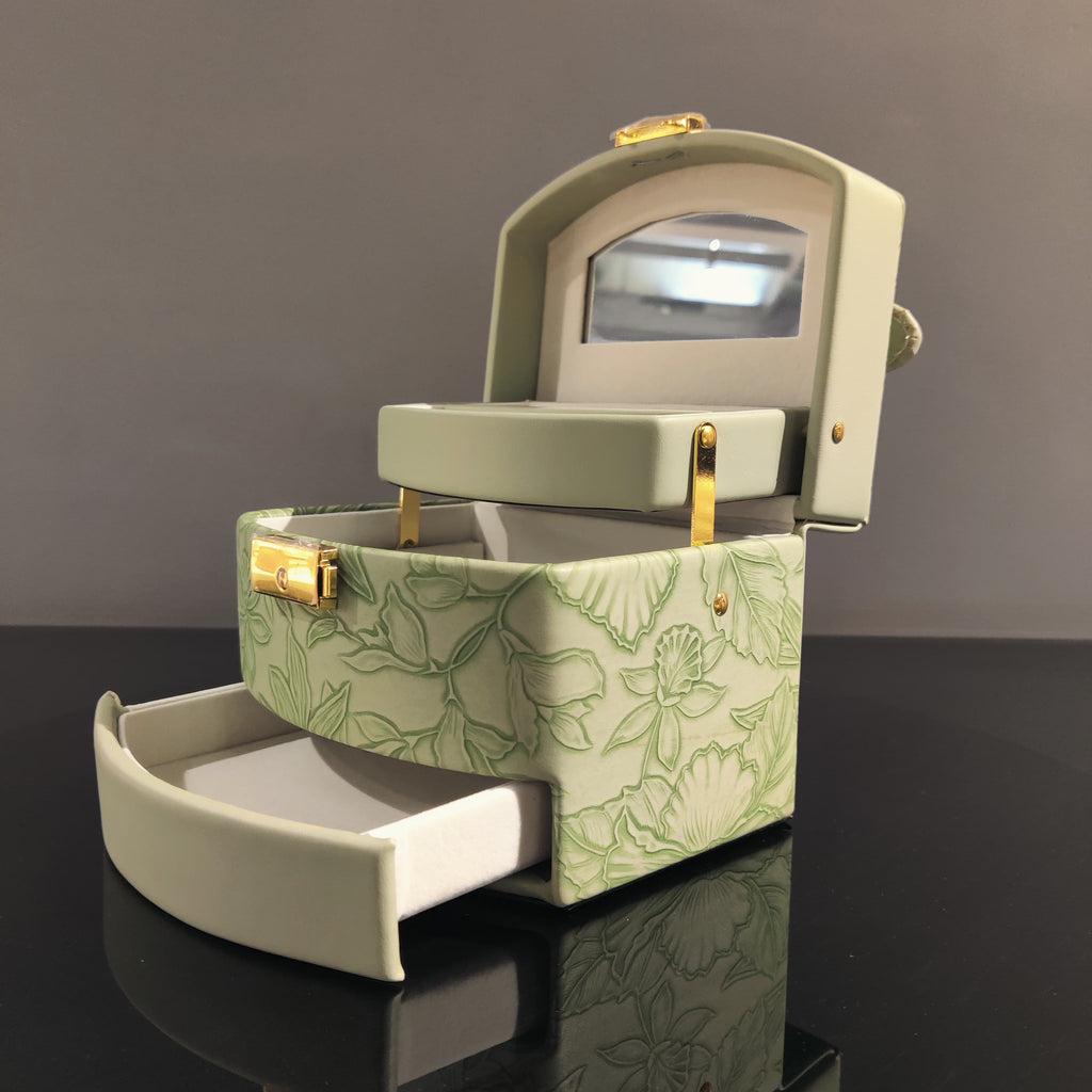 Sage green jewelry organizer box with ring holder and storage compartments