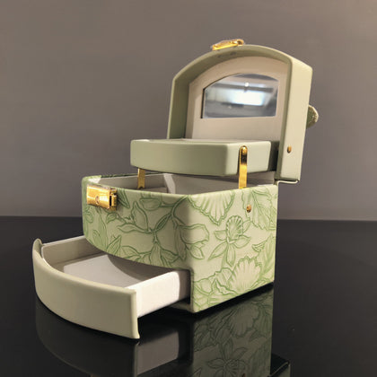 Sage green jewelry organizer box with ring holder and storage compartments
