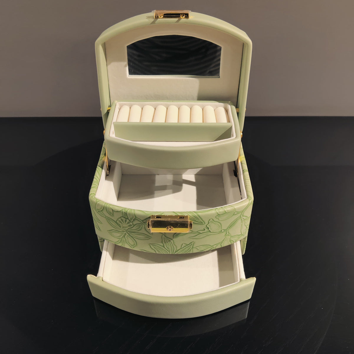 Sage green jewelry organizer box with ring holder and storage compartments