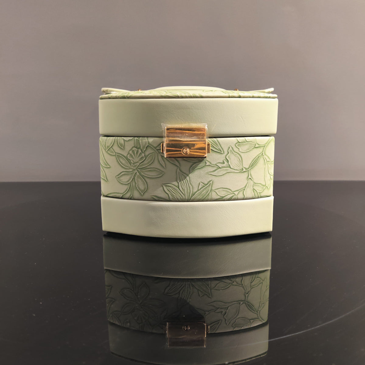 Sage green jewelry organizer box with ring holder and storage compartments