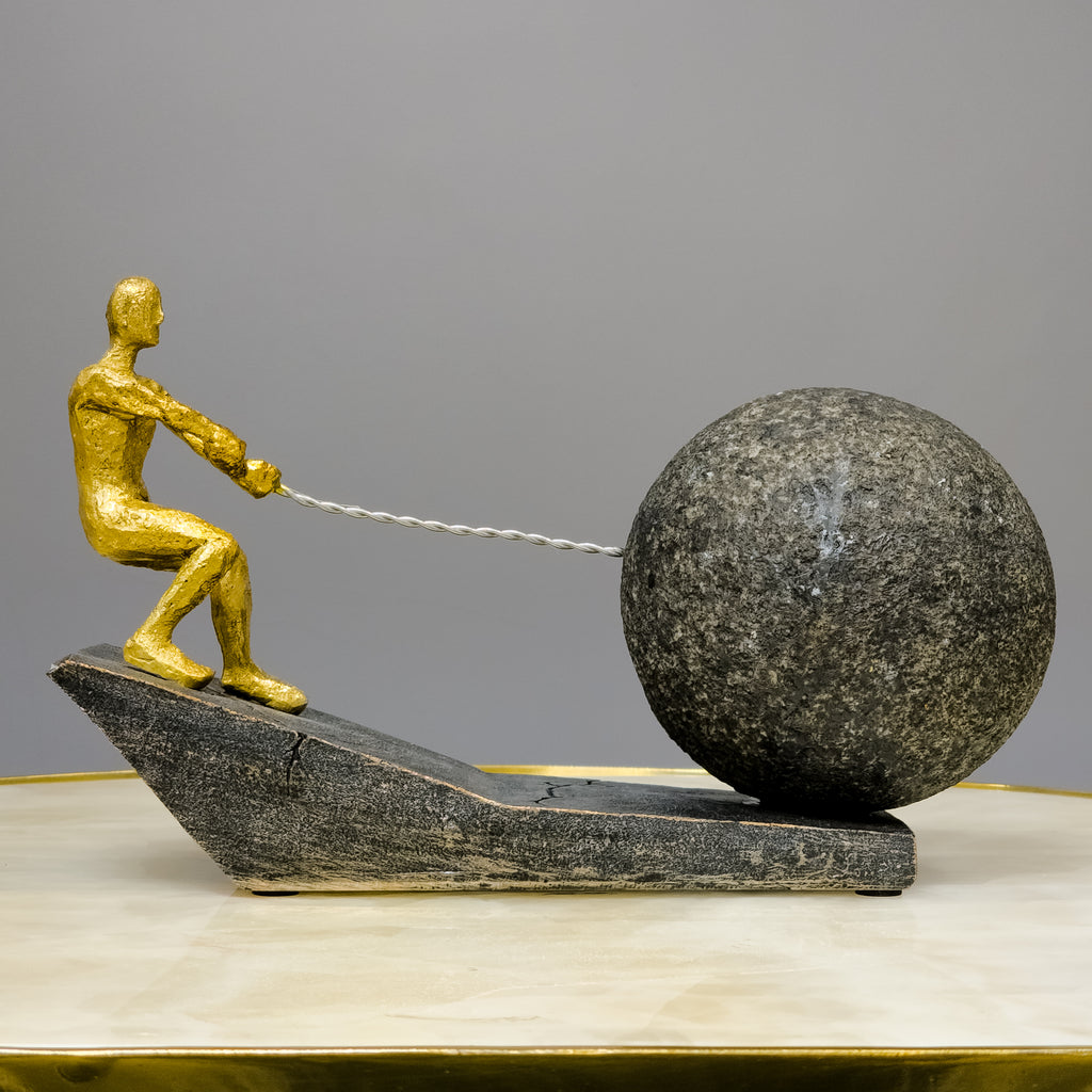 gold abstract human figure decor pulling sphere modern tabletop accent