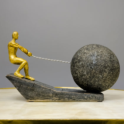 gold abstract human figure decor pulling sphere modern tabletop accent