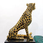 Decorative golden leopard sculpture with premium electroplated finish and seated posture