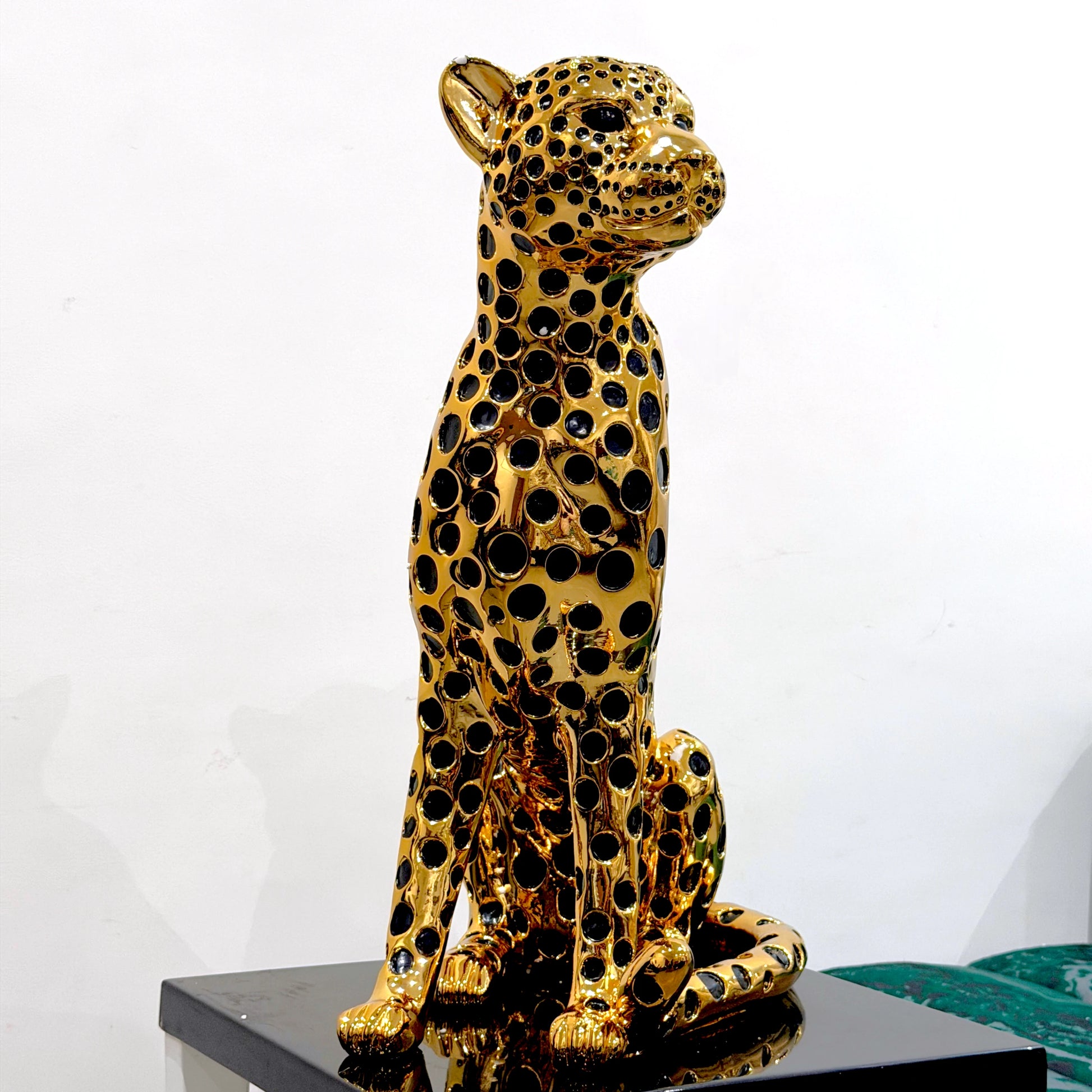 Decorative golden leopard sculpture with premium electroplated finish and seated posture