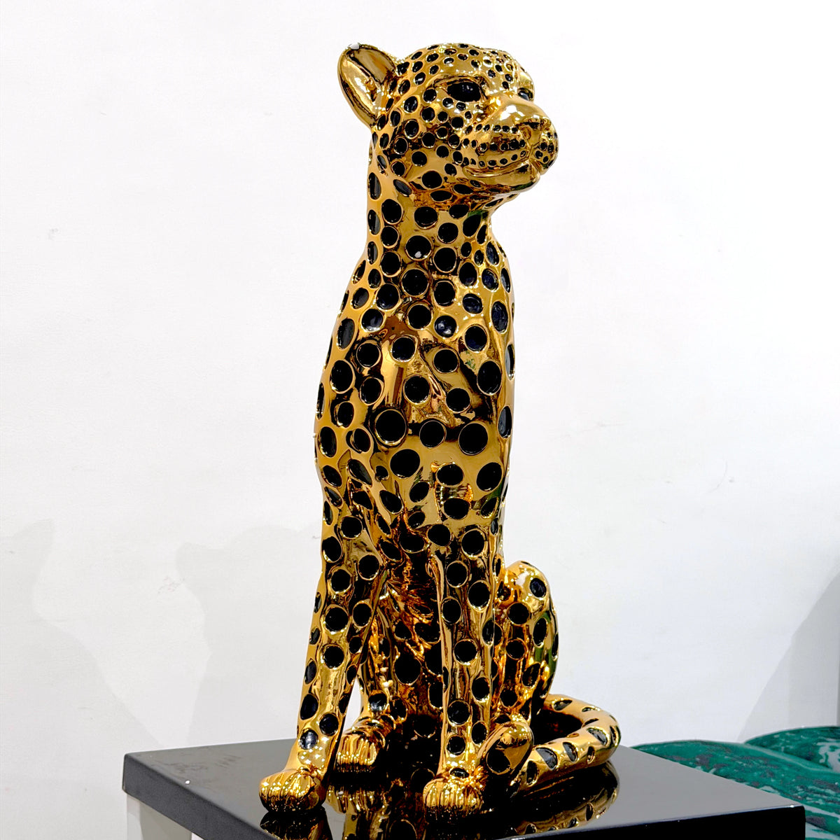 Decorative golden leopard sculpture with premium electroplated finish and seated posture