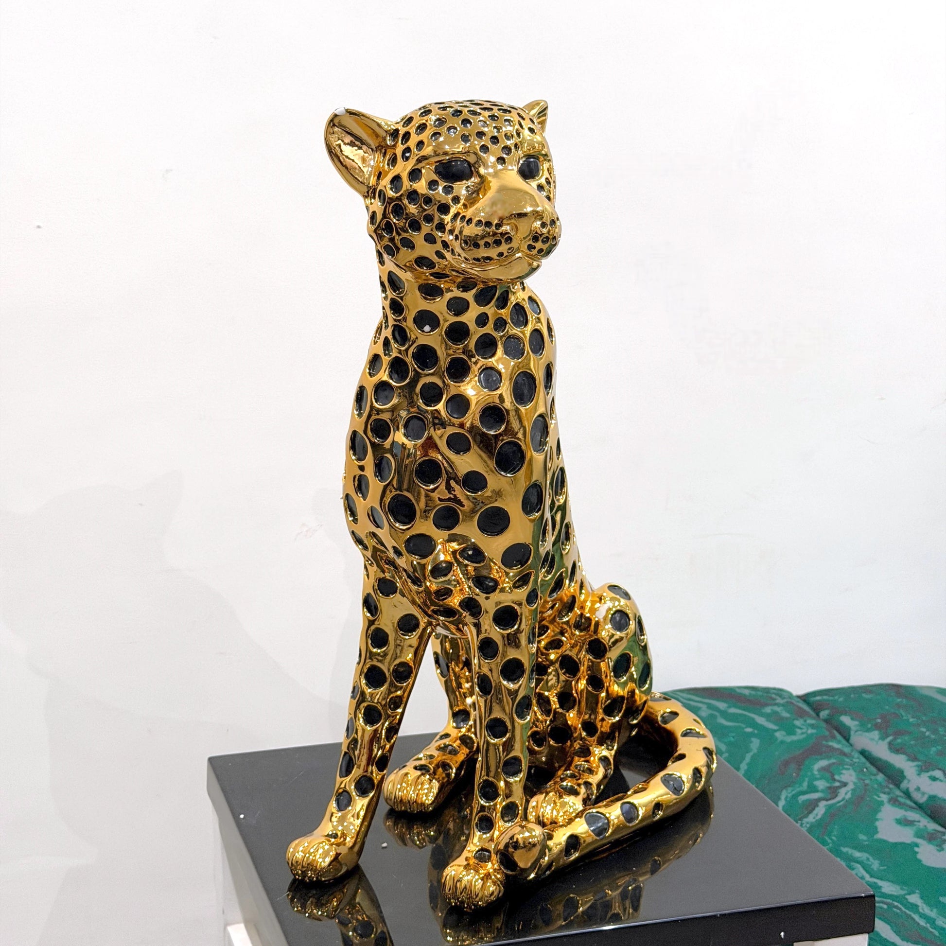 Modern luxury leopard figurine in gold and black for tabletop and console styling