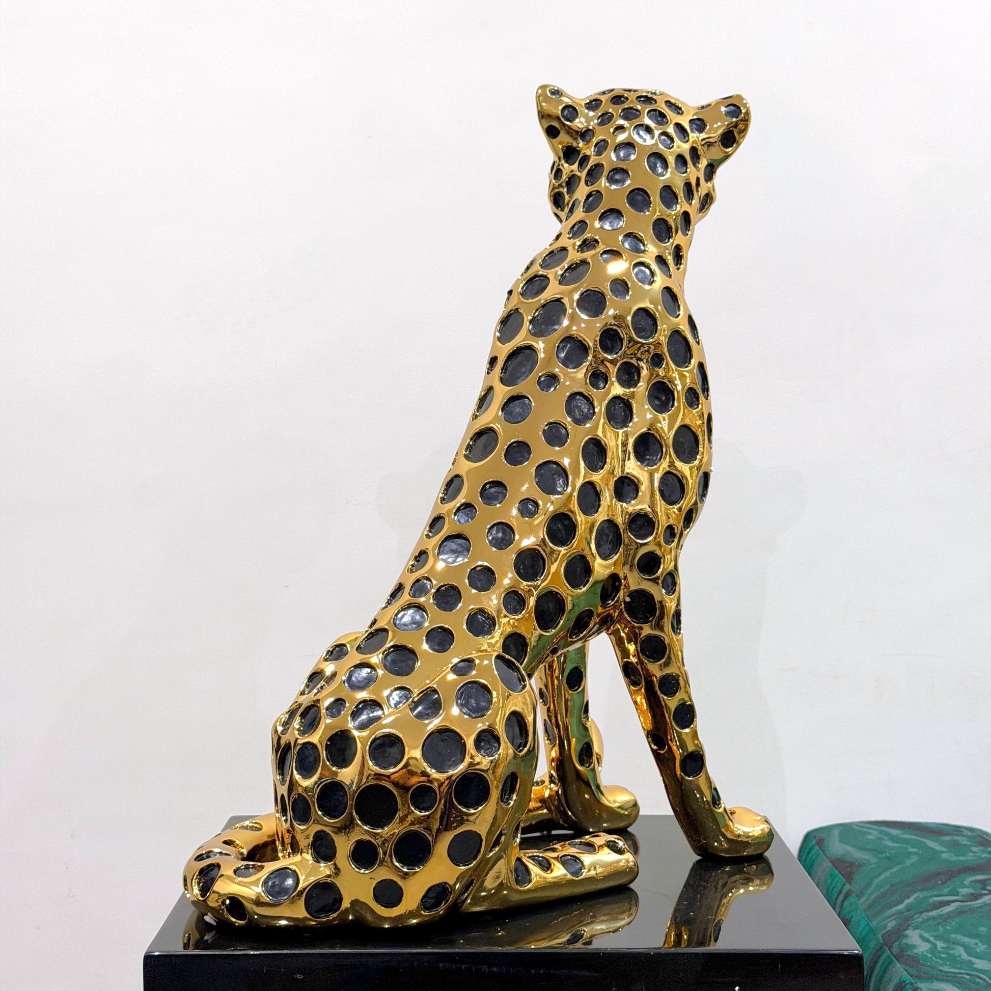 Modern luxury leopard figurine in gold and black for tabletop and console styling