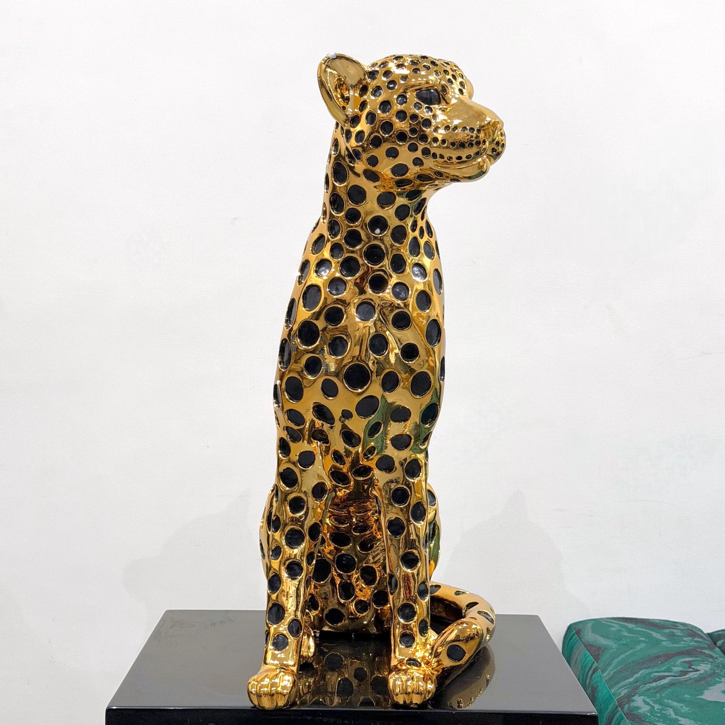 Decorative golden leopard sculpture with premium electroplated finish and seated posture