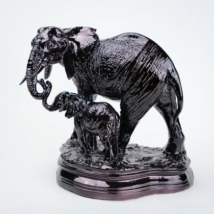Statue of two elephants on a white background