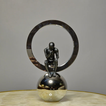 modern abstract human figurine decor with metallic ring and reflective sphere base