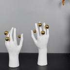 Abstract right hand pair on dark surface
