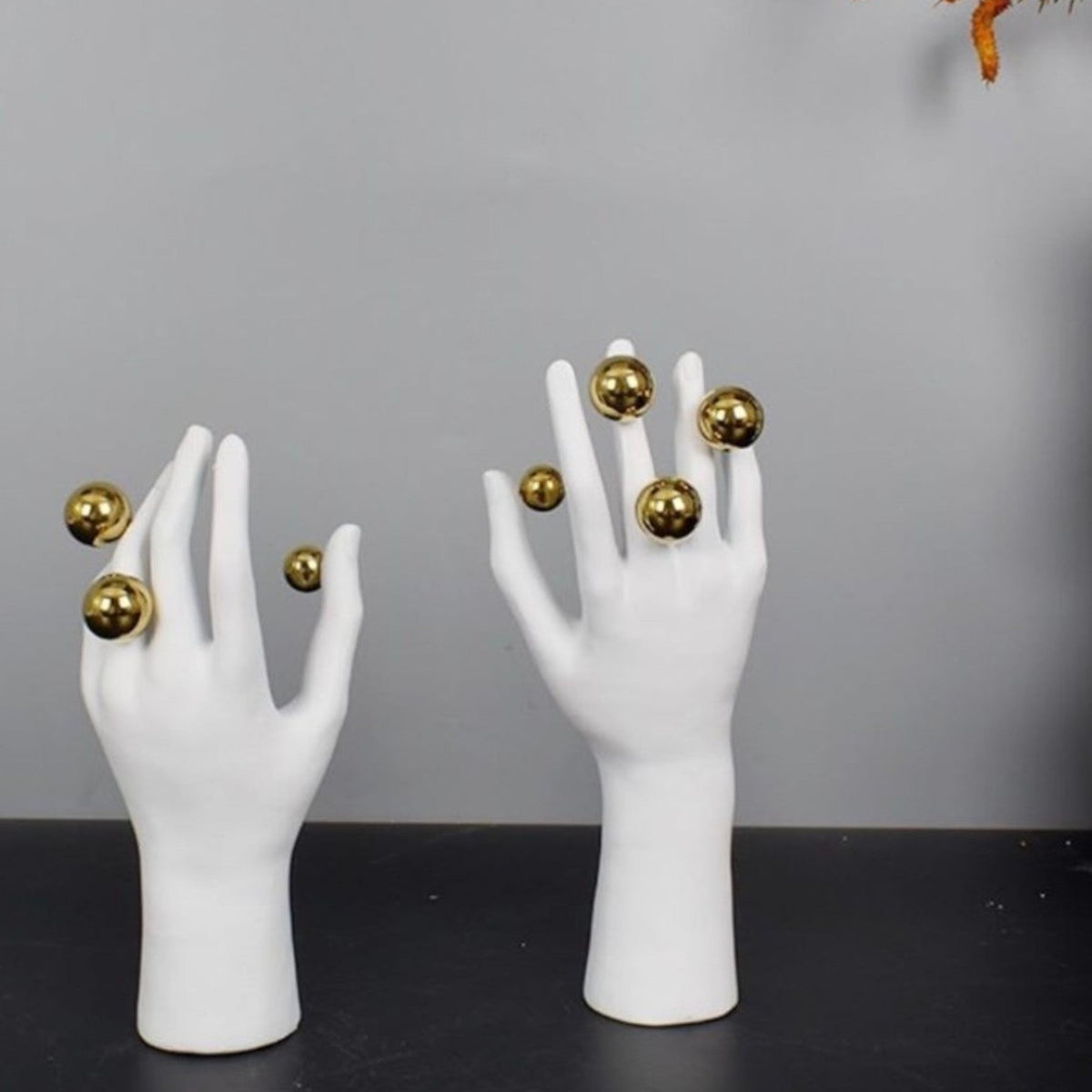 Abstract right hand pair on dark surface