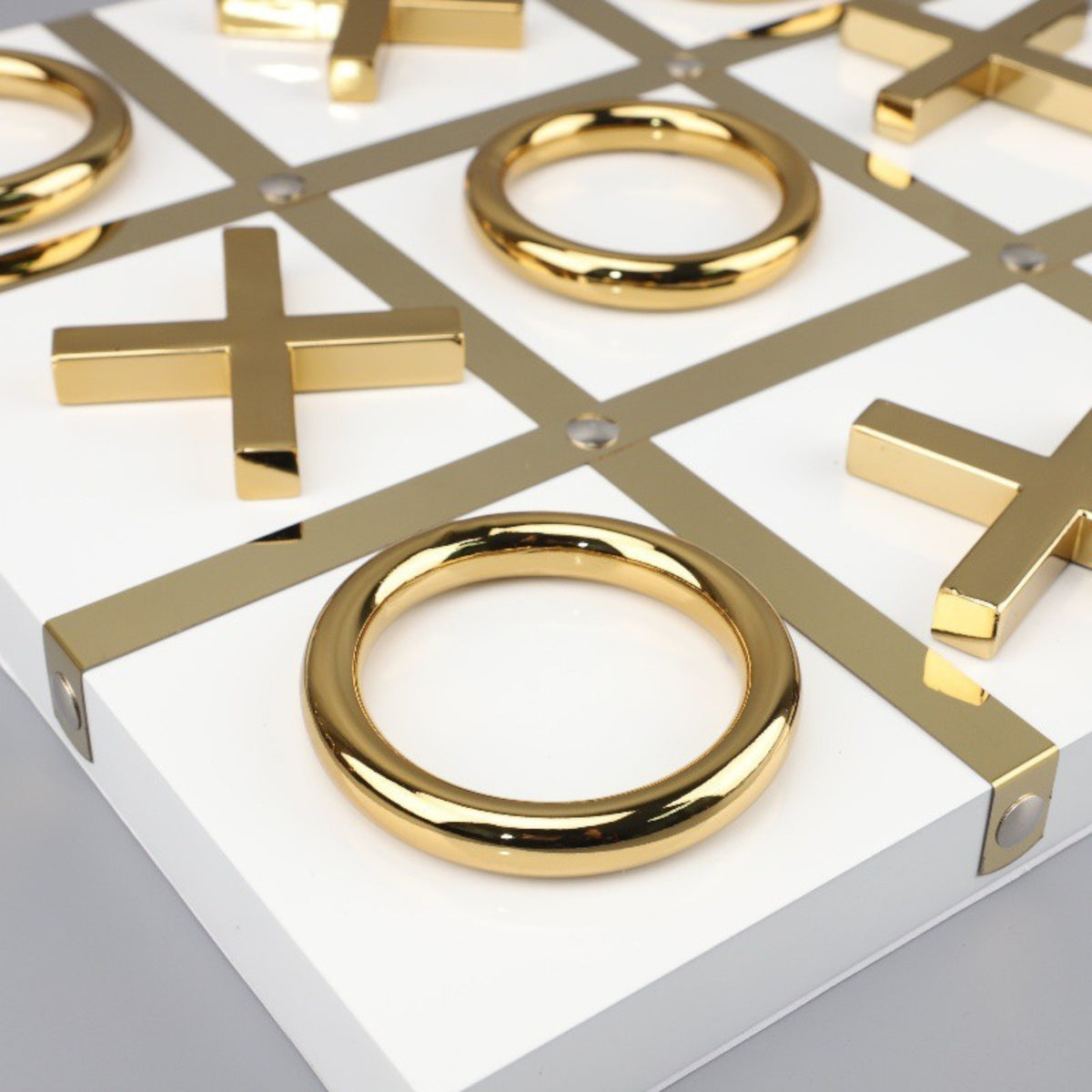 Tic-tac-toe macro, gold ring on white base