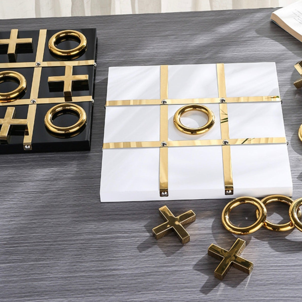Tic-tac-toe white & black sets on wood table
